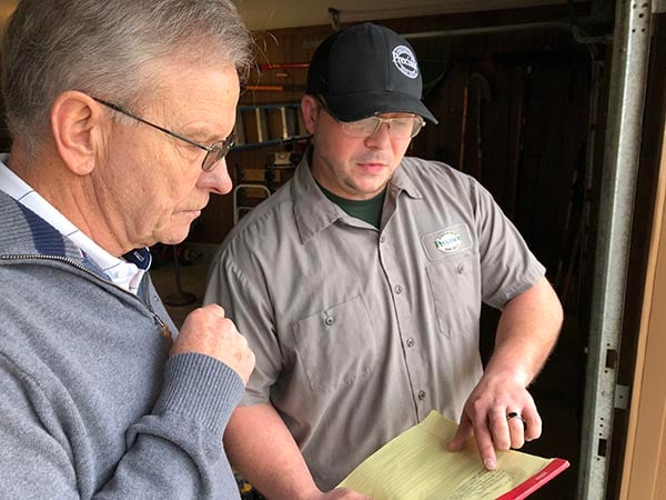 Customer and technician review what was found in 25-point inspection Customer and technician review what was found in 25-point inspection