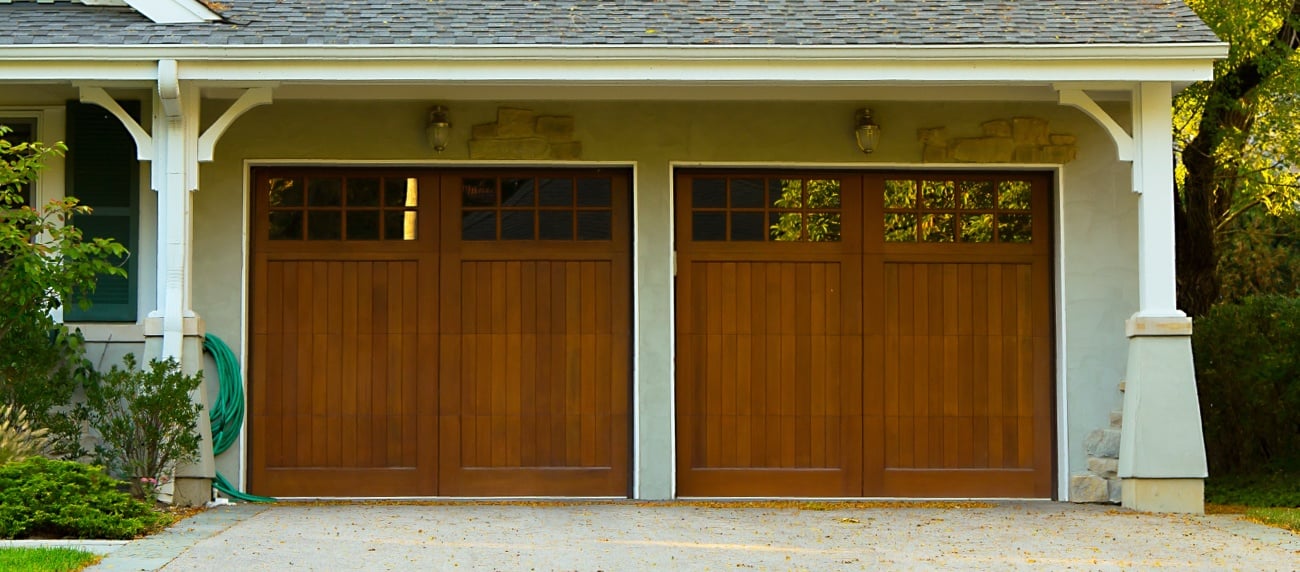House with Two Wooden Garage Doors