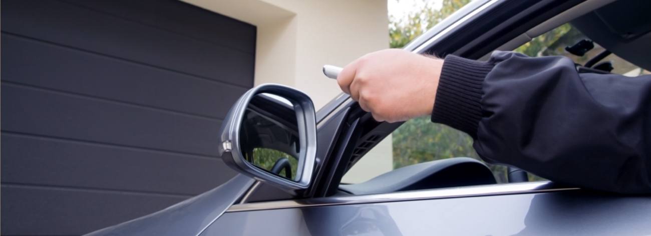 Homeowner Leaving Home and Shutting Garage Door with Device