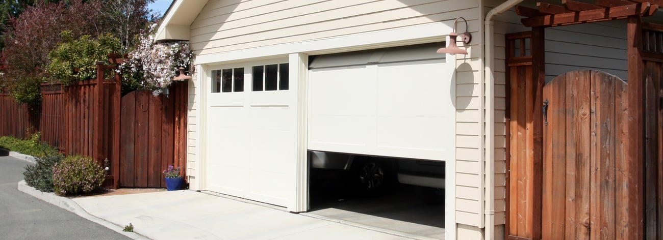 Noisy double garage doors opening from the outside