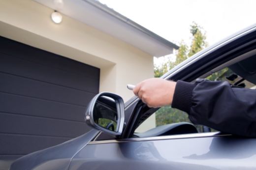 Person in Car Using Remote for Stuck Garage Door