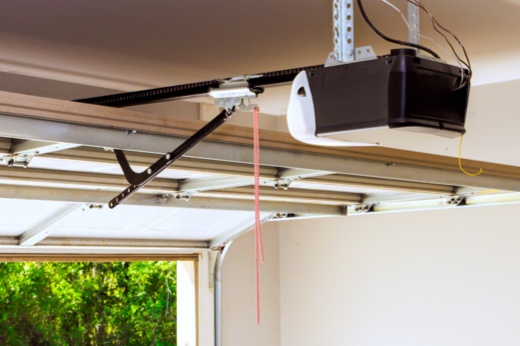 Open garage door with focus on interior garage door opener