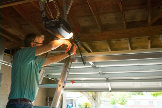 Technician Performing Maintenance on Garage Door Opener