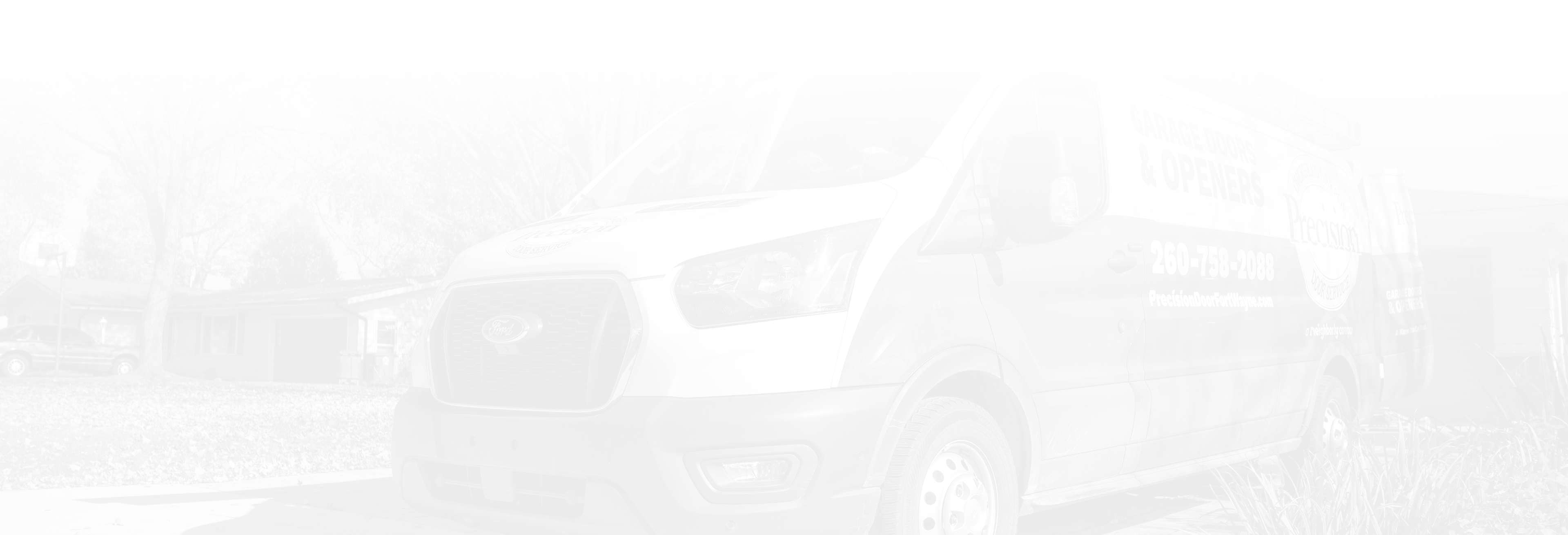 Precision Garage Door Service of Fort Wayne van in residential driveway.