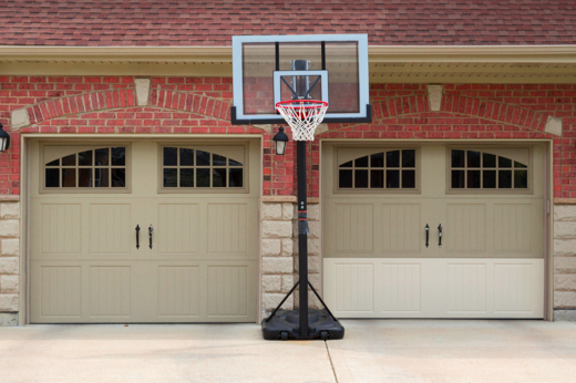 Two Garage Door Unit with Basketball Hoop in Front