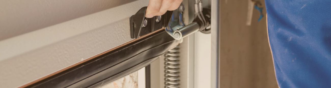 Technician Inspecting Garage Door
