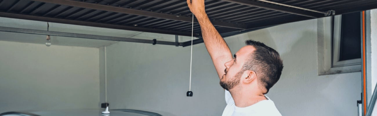 Homeowner Raising Garage Door