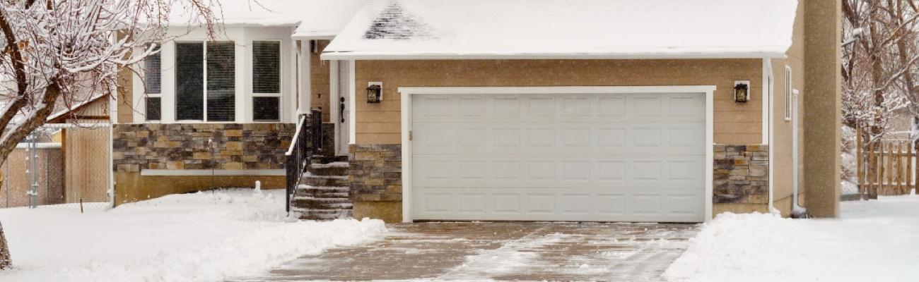 Sidewalk View of Home Covered in Snow