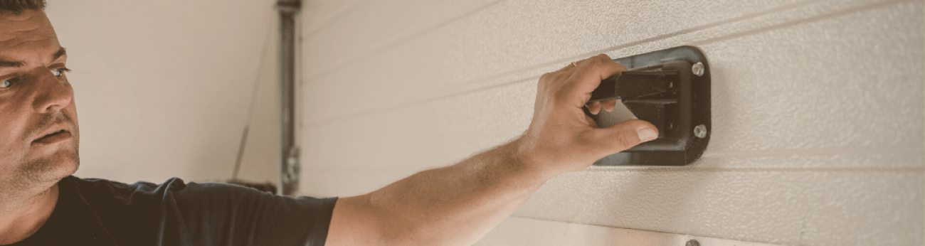 Technician Inspecting a Garage Door