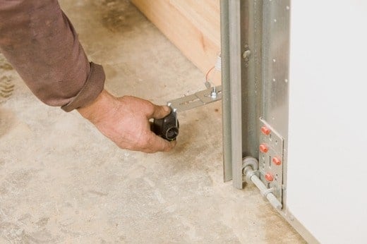 Technician Performing Garage Door Maintenance