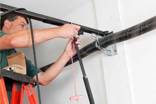 Precision Technician Fixing Garage Door Issue