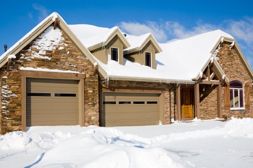 House and Driveway Covered in Snow